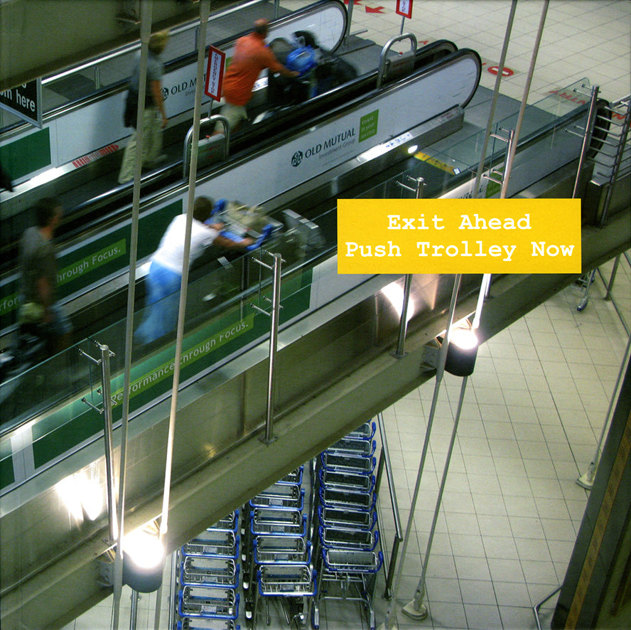 Exit Ahead Push Trolley Now